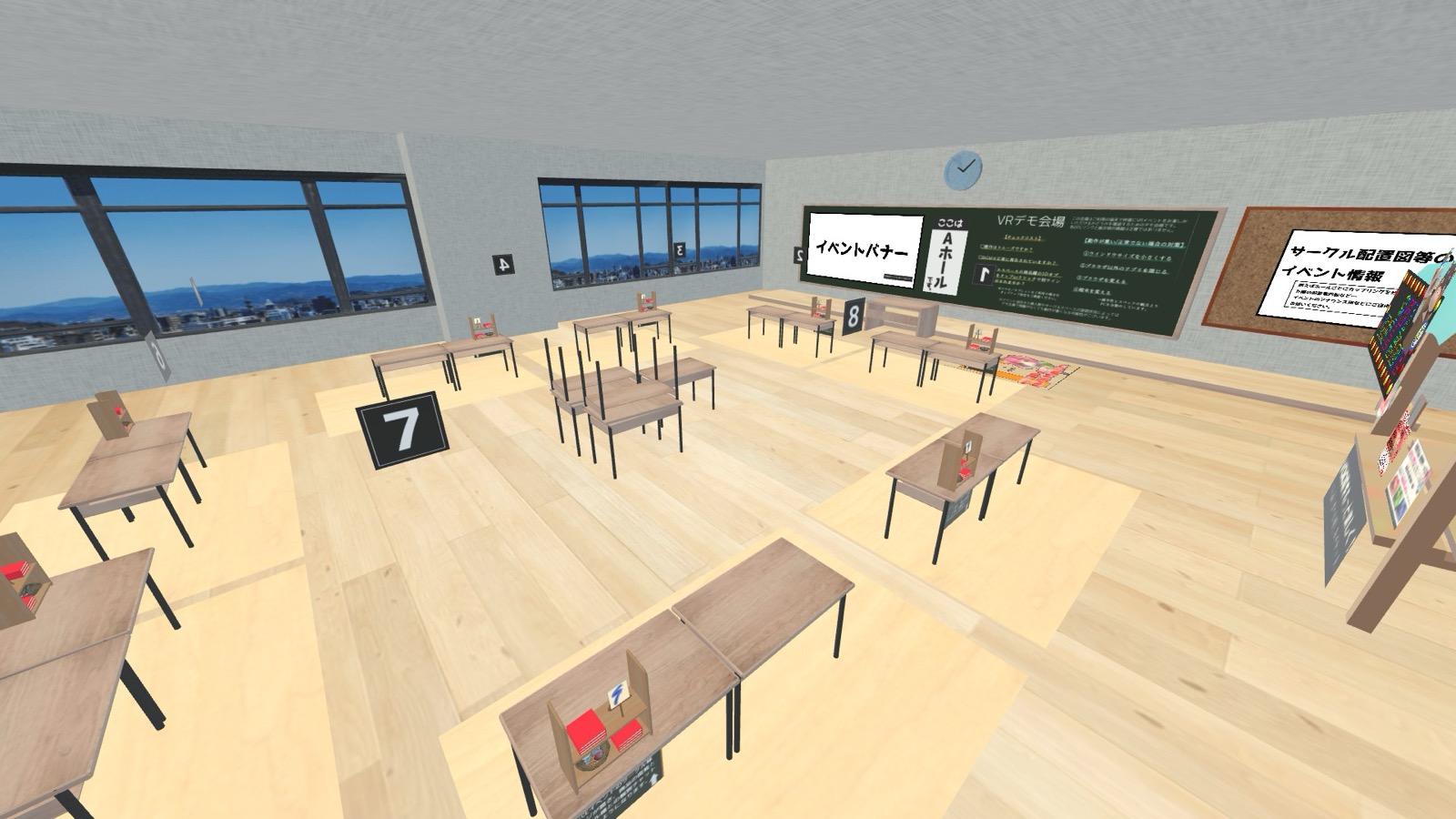 実際のVR即売会デモ会場。ブース机にスペース番号札とサークル頒布物が並び、黒板にイベント案内が掲示されている
